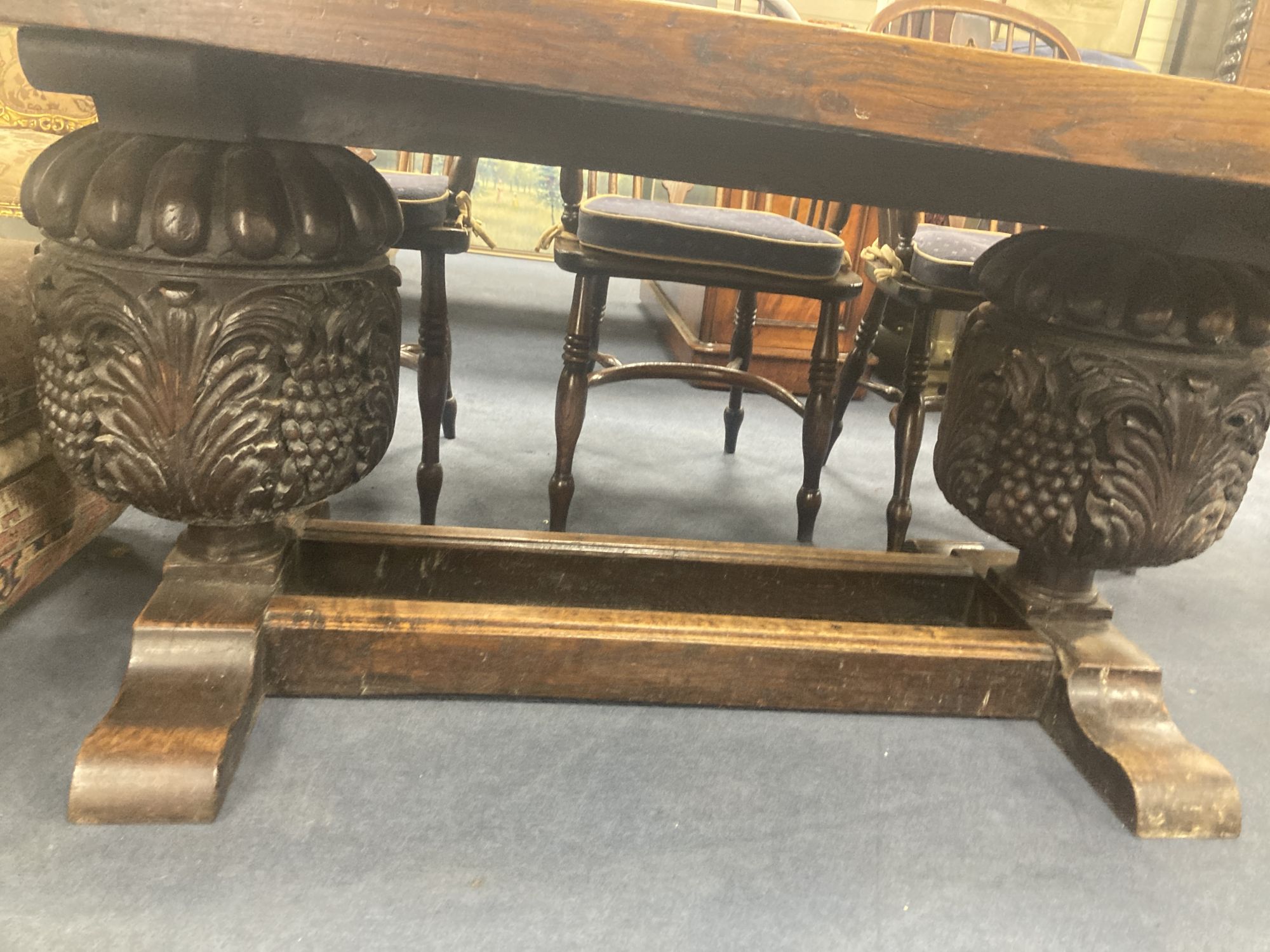 An oak refectory table, the top (formerly a door), length 209cm, depth 85cm, height 73cm